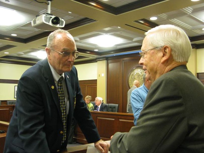 Benewah County Sheriff Bob Kirts, left, greets Rep. Mack Shirley, R-Rexburg, a member of the House Judiciary Committee, after the committee on Wednesday agreed to hold the Coeur d'Alene Tribe's law enforcement legislation due to a new cross-deputization agreement between the tribe and Benewah County. (Betsy Russell)