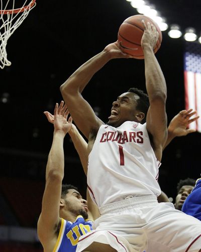 Washington State’s Renard Suggs shoots over UCLA’s Noah Allen. (Young Kwak / Fr159675 Ap)