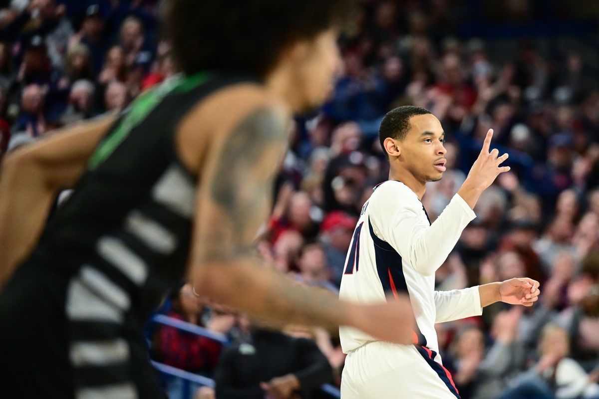 Gonzaga Bulldogs guard Nolan Hickman (11) reacts after hitting a three against the Chicago State Cougars during the second half of a college basketball game on Wednesday, March 1, 2023, at McCarthey Athletic Center in Spokane, Wash. Gonzaga won the game 104-65.  (Tyler Tjomsland/The Spokesman-Review)