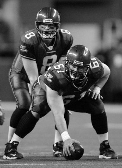 
Robbie Tobeck gets set to snap to Matt Hasselbeck during the NFC Championship game against Carolina.   
 (Associated Press / The Spokesman-Review)
