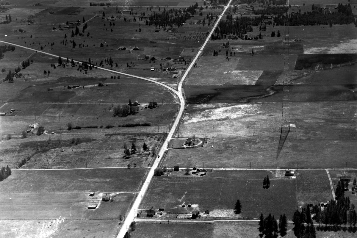 Looking south in this 1949 photo, the Old Palouse Highway peals off of Regal Street around 42nd Avenue on the South Hill. A long-gone KHQ radio tower sits alone on the right. Now, the intersection has been rationalized into 90-degree angles, and the Target store sits near the elbow of the “Y.” The tower and art deco transmitter building were demolished in 1961, replaced over time by the Adirondack Lodge Apartments, a retail complex with Twigs Bistro and Martini Bar, and the Educational Service District 101 conference center. (Ferris Archives/Northwest Museum of Arts and Culture)