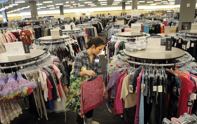 Nordstrom Rack employee Genna Sciamanda, of Cheney, checks the tags for sizes in the children’s section of the new Rack store at the Spokane Valley Mall. The Rack is moving from NorthTown Mall to the Valley location and will be open on Thursday.  (Dan Pelle)