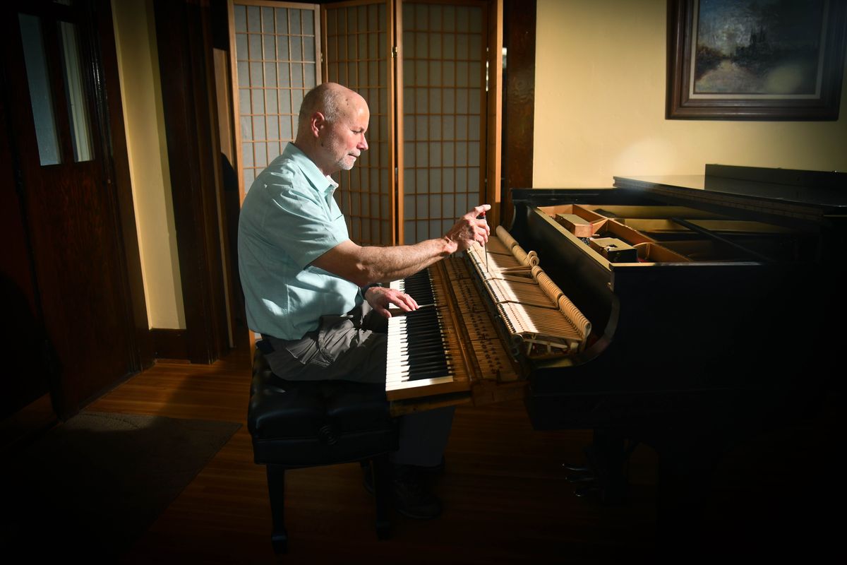 Spokane piano restorer Ken Eschete repaired a 19th-century Blüthner piano housed in state Capitol that once belonged to Spokane musicologist Hans Moldenhauer. Here he demonstrate the hammer drop adjustment on June 16, 2021 on his 1923 Steinway in his north Spokane home. (Dan Pelle/THE SPOKESMAN-REVIEW)