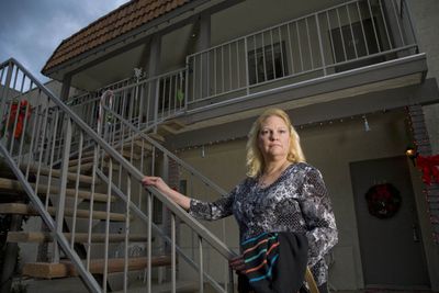 Diane Shackle poses in front of her condo in Calimesa, Calif. (Associated Press / The Spokesman-Review)