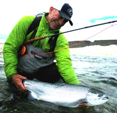 Master fly fisherman Tim Rajeff of Vancouver, Wash., lands a monster rainbow in Strobel Lake, Argentina. (courtesy)