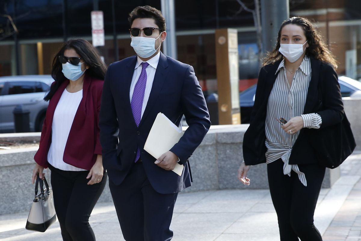 Former Fall River Mayor Jasiel Correia, center, arrives to the John Joseph Moakley United States Courthouse, Monday, April 26, 2021, in Boston. Opening statements in Correia
