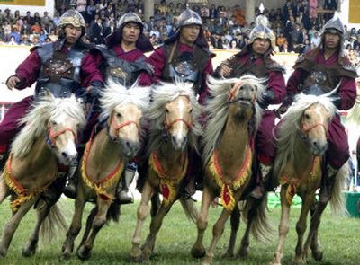 
Horsemen in traditional apparel perform Tuesday in Ulan Bator, Mongolia. Mongolians celebrated the 800th anniversary of Genghis Khan's march to world conquest.
 (Associated Press / The Spokesman-Review)