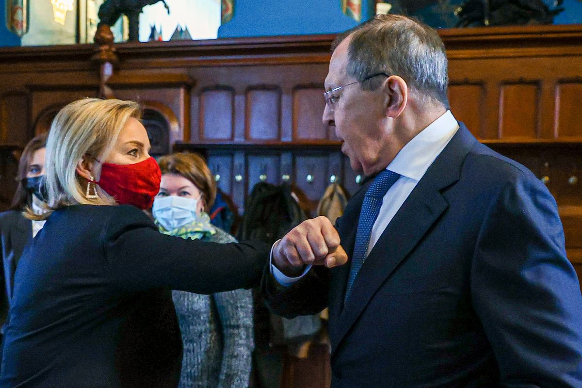 In this handout photo released by Russian Foreign Ministry Press Service, Russian Foreign Minister Sergey Lavrov, right, and British Foreign Secretary Liz Truss greet each other prior to their talks in Moscow, Russia, Thursday, Feb. 10, 2022. Britain