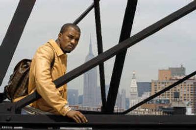
Singer Kanye West poses on a rooftop in the Soho section of New York City, with the Empire State Building in the background. 
 (Associated Press / The Spokesman-Review)