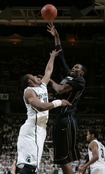 Purdue’s JaJuan Johnson, right, shoots over MSU’s Delvon Roe.  (Associated Press)