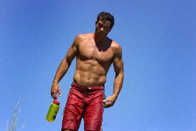 
Jud Keiser, 45, flashes the physique that comes from kayaking 300 days a year and doing more than 1,000 sit-ups a day. 
 (Jed Conklin / The Spokesman-Review)