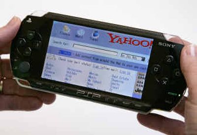 
A Sony PlayStation Portable displays the Yahoo home page. PlayStation Portable has capabilities that Sony neglected to tell you about: as a Web browser, a movie player and an electronic book reader. 
 (Associated Press / The Spokesman-Review)
