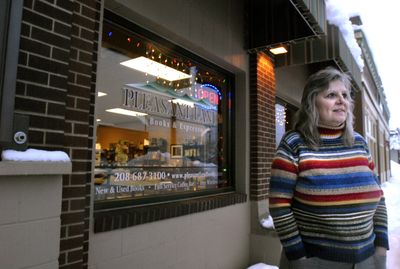 Jan Conner stands in front of her store in Rathdrum Jan. 6, where she believes the foot traffic at Pleasant Land Books and Espresso has been down because her customers have had a hard time getting out of their homes during recent snow storms.  (Jesse Tinsley / The Spokesman-Review)