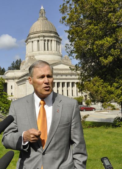 OLYMPIA -- Gov. Jay Inslee  holds an Earth Day press conference on the press house lawn on April 22, 2015. (j)