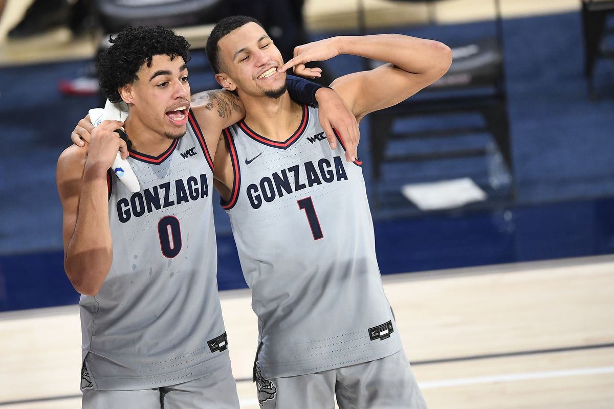 Gonzaga Bulldogs guard Julian Strawther (0) and guard Jalen Suggs (1) mug for a cameraman following the second half of a college basketball game on Saturday, January 23, 2021, at McCarthey Athletic Center in Spokane, Wash. Gonzaga won the game 95-49.  (Tyler Tjomsland/THE SPOKESMAN-RE)