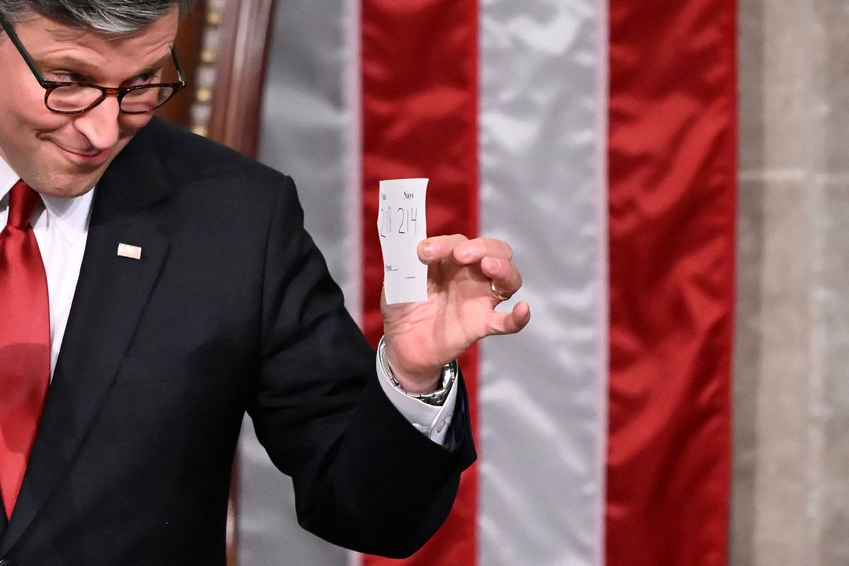 US House Speaker Mike Johnson shows the final tally of the vote on US President Donald Trump