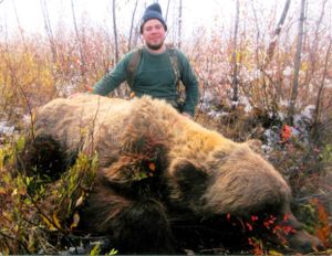 Larry Fitzgerald of Fairbanks poses by his record-book grizzly killed in 2013 near Fairbainks, Alaska. The bear measured 27-6/16 by Boone and Crockett scorers. It missed the world's record mark by 7/16 of an inch but is the largest grizzly ever taken by a hunter. The record is from a skull that was found. (courtesy)