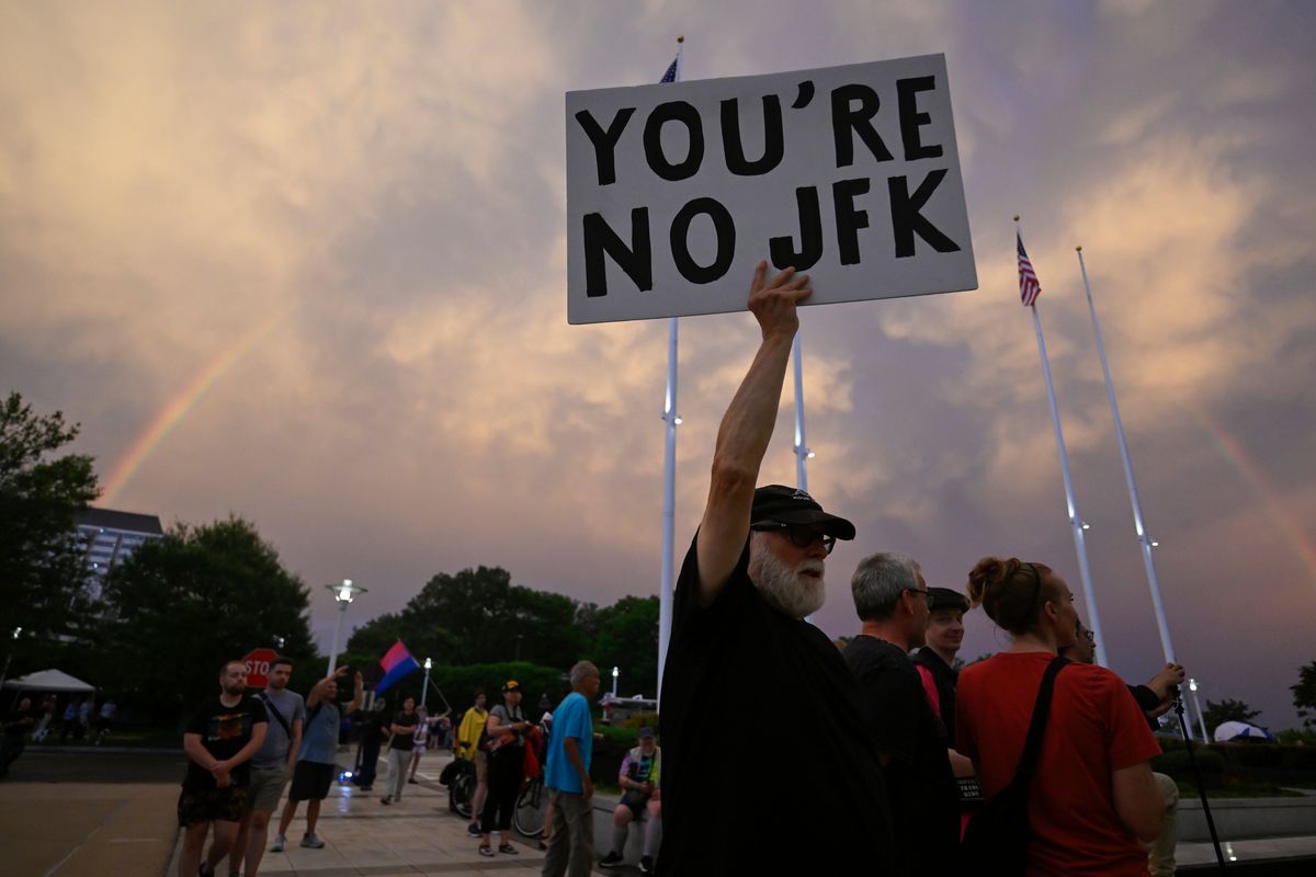 Demonstrators cheered the arrival of a rainbow after storm clouds. (Craig Hudson/For The Washington Post)  (Craig Hudson/For The Washington Post)