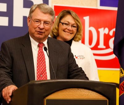  In this May 20, 2014, file photo, Idaho Secretary of State candidate Lawerence Denney, with his daughter Jennifer, gives a speech during the Idaho GOP Primary election night event in Boise. Denney said he has a new appreciation for county clerks and election staff after spending two days as a poll worker in Lewiston on Election Day 2016. (AP Photo/Otto Kitsinger, File) 