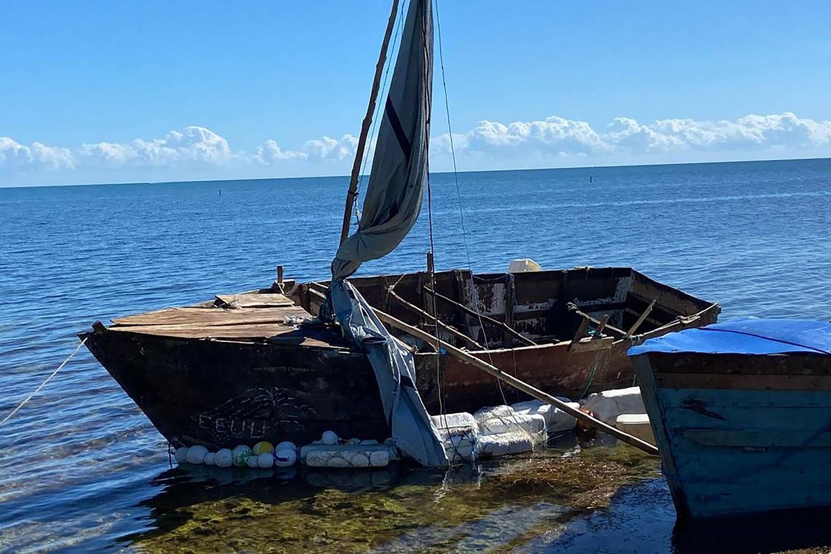 A steel-hulled, makeshift migrant sailboat is grounded near the mangroves of Harry Harris Park in the Upper Keys area of Tavernier on Tuesday.  (David Goodhue/Miami Herald/TNS)