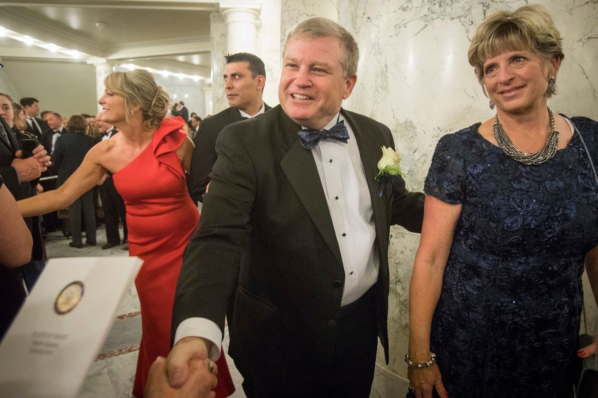 FILE - Idaho Attorney General Lawrence Wasden and his wife, Tracey Wasden, attend the Inaugural Procession and Ball on Jan. 5, 2019, in Boise, Idaho. Wasden is seeking a sixth term as state attorney general. Idaho
