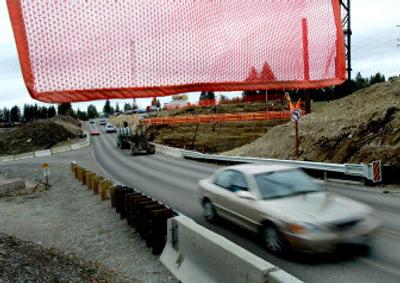 
Traffic moves through the Seltice Road bridge replacement construction on Monday in Idaho.
 (Kathy Plonka / The Spokesman-Review)