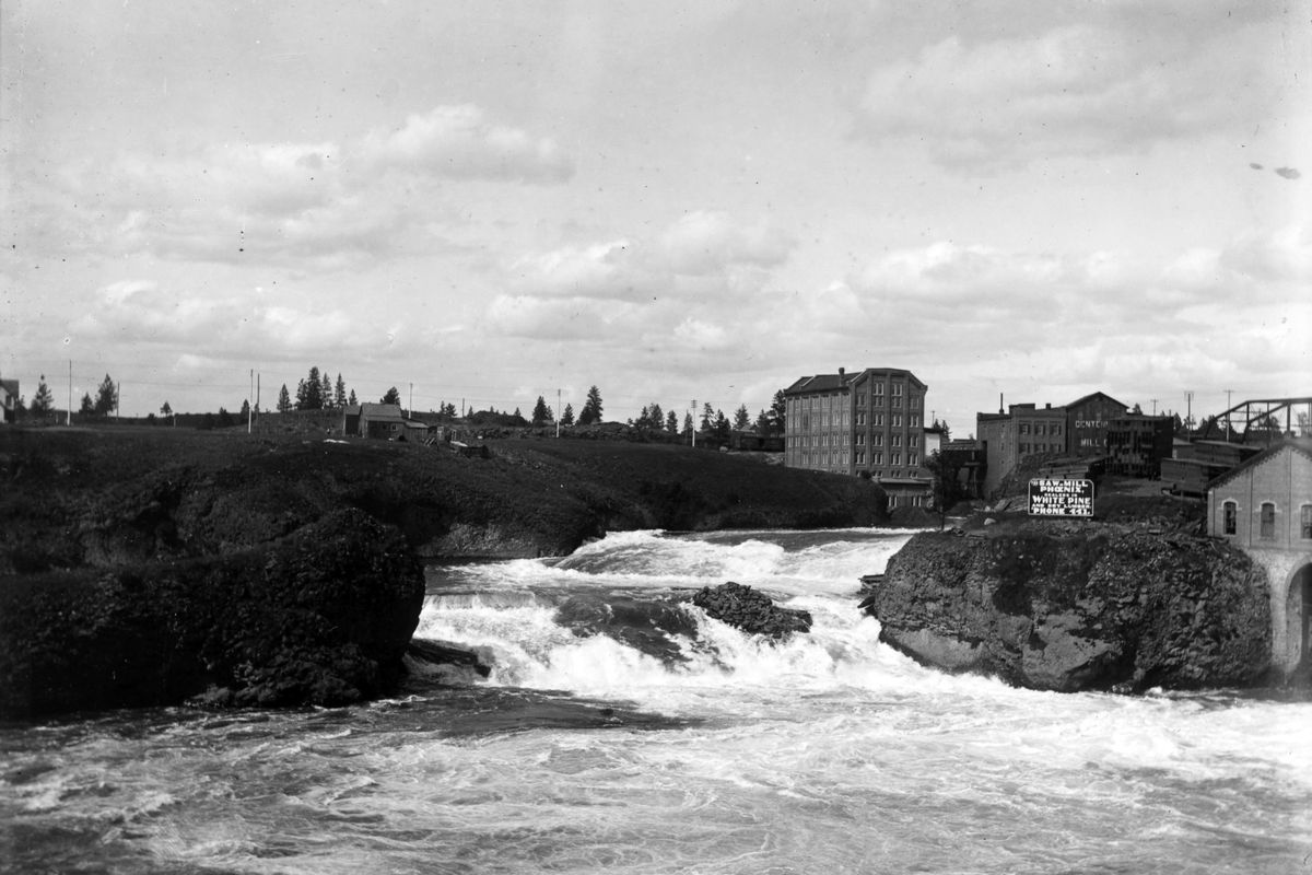 Circa 1895: The Spokane Flour Mill, center right, is on the north bank of the Spokane River. Backers wrangled over ownership until it opened in 1900.