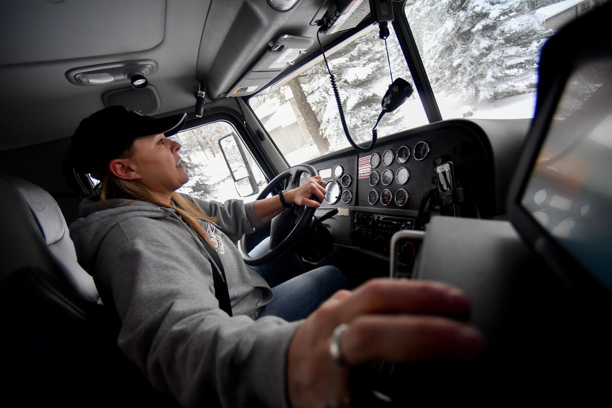 Sandy Aukerman, a Spokane County road maintenance specialist drives her snowplow on Wednesday, Feb. 13, 2019, in Spokane, Wash. (Tyler Tjomsland / The Spokesman-Review)