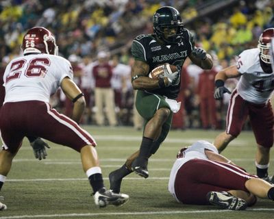 Hawaii’s Daniel Libre finds a gap in WSU defense.  (Associated Press / The Spokesman-Review)