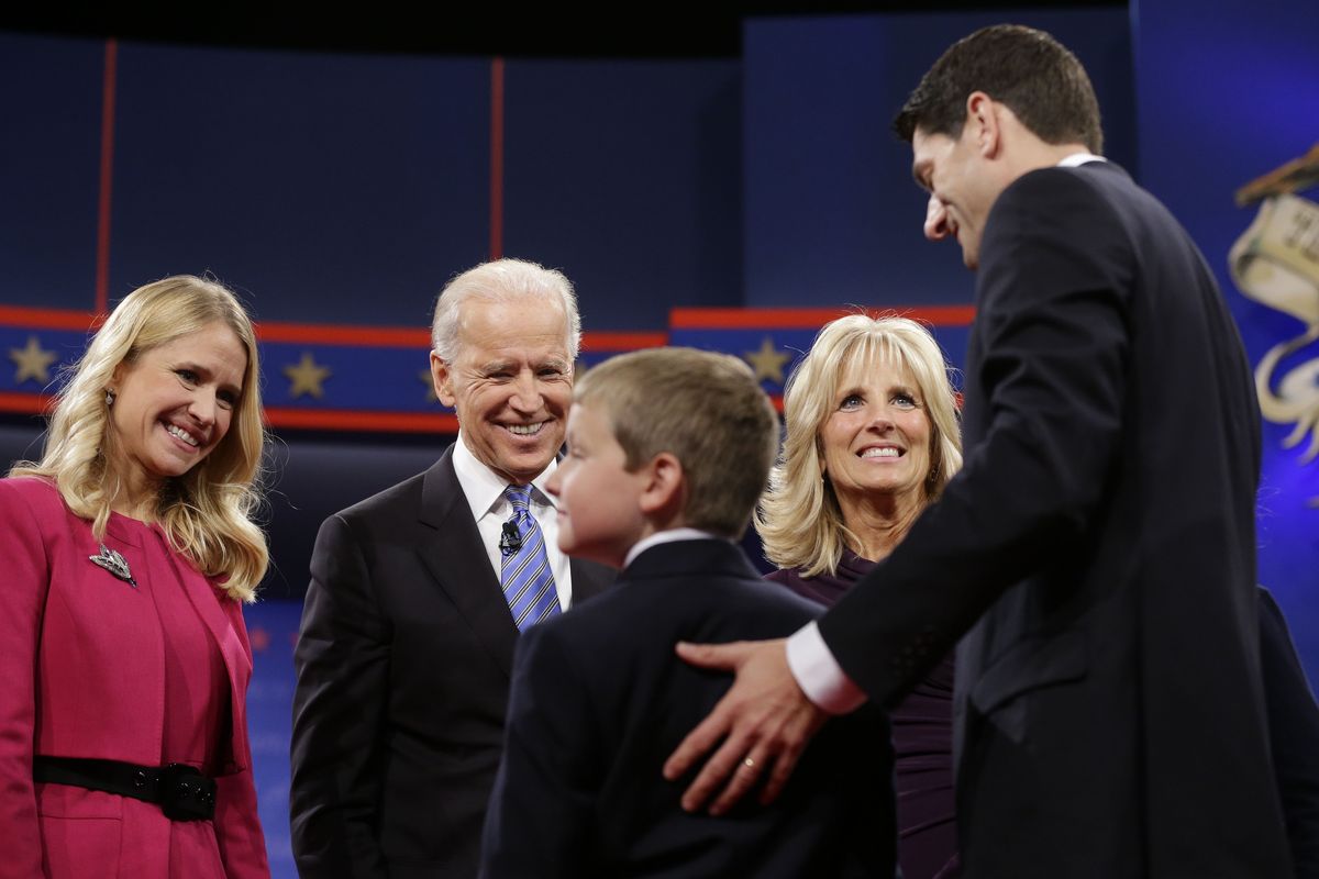 Vice President Joe Biden, center, and his wife Jill Biden, meet with Republican vice presidential candidate, Rep. Paul Ryan, R-Wis., right, his wife Janna Ryan, left, and son Charlie Ryan, center, on stage after the vice presidential debate, at Centre College in Danville, Ky., Thursday, Oct. 11, 2012. (Pablo Monsivais / Associated Press)