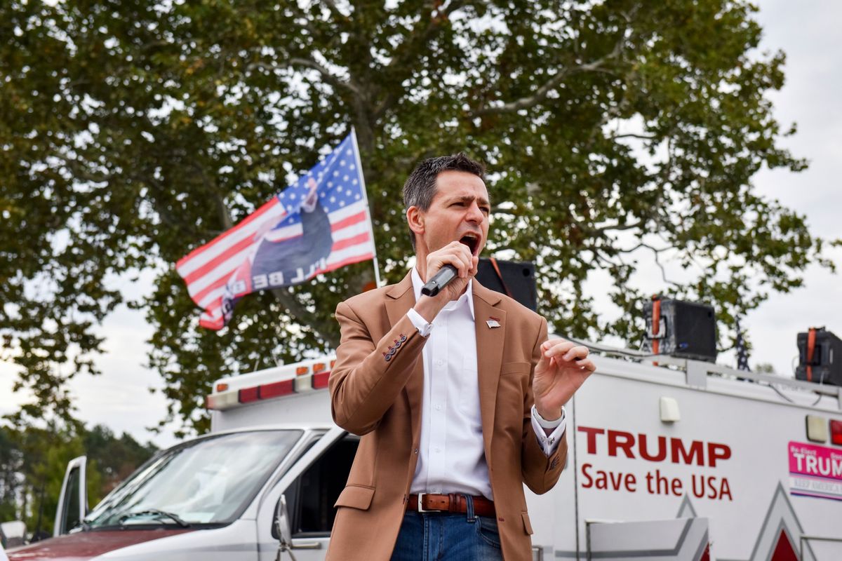 Ryan Kelley, a Republican running for governor in Michigan, speaks on Oct. 2 during a gathering of supporters of former President Donald Trump in Holland, Mich.  (EMILY ROSE BENNETT)