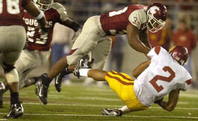 Washington State strong safety Eric Frampton levels Southern California wide receiver Steve Smith during fourth-quarter action on Saturday in Pullman.
(Christopher Anderson / The Spokesman-Review)