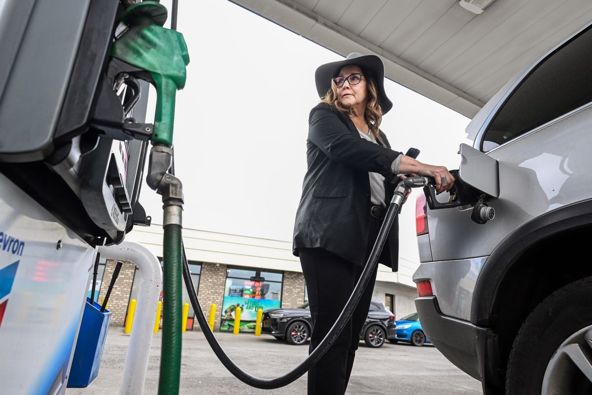 “Gas prices are crazy high,” said Brenda Tampien as she fills up her vehicle for $4.39 a gallon at the Chevron station on the corner of Third Avenue and Monroe Street on Wednesday.  (COLIN MULVANY/THE SPOKESMAN-REVIEW)