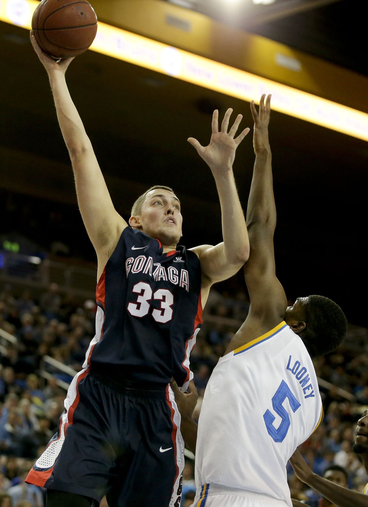 Gonzaga’s Kyle Wiltjer shot over and around Kevon Looney and UCLA to the tune of 24 points. (Associated Press)