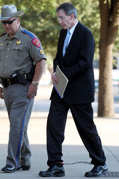 Convicted polygamist leader Warren Jeffs is escorted into the courthouse Tuesday in San Angelo, Texas. (Associated Press)