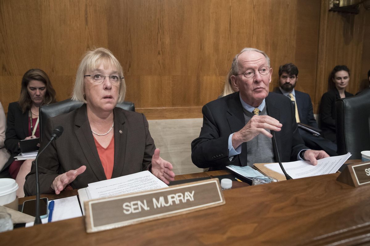 In this Oct. 18, 2017, file photo Sen. Patty Murray, D-Wash., the ranking member, and Sen. Lamar Alexander, R-Tenn., chairman of the Senate Health, Education, Labor, and Pensions Committee, talk before the start of a hearing on Capitol Hill in Washington. (J. Scott Applewhite / Associated Press)
