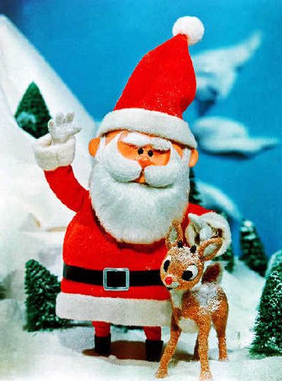 
Santa stands beside his favorite reindeer, Rudolph, in a scene from 