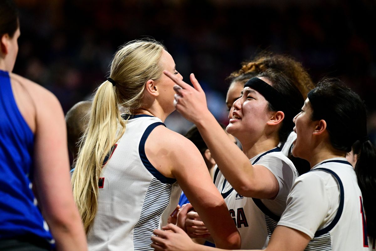 Gonzaga Bulldogs coach Lisa Fortier trains her gaze on the court during Monday’s semifinal at the West Coast Conference tournament in Las Vegas. The Bulldogs face the Portland Pilots in the title game Tuesday.  (Tyler Tjomsland/The Spokesman-Review)