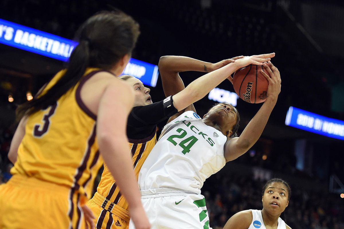 Oregon forward Ruthy Hebard (24) hauls in a rebound during a NCAA regional semi-final basketball game, Sat., March 24, 2018, in the Spokane Arena. (Colin Mulvany / The Spokesman-Review)