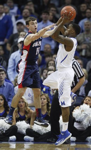 Gonzaga guard David Stockton tries to bother a shot by Memphis guard Joe Jackson during first-half action Saturday. (Associated Press)