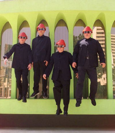 
Members of Devo, from left, Gerald Casale, Bob Mothers- baugh, Mike Mothers- baugh and Bob Casale, jump from a ledge outside their recording studio in the Hollywood in 2000. Devo, the seminal 1970s band that played futuristic music is extending its sound through Devo 2.0.
 (Associated Press / The Spokesman-Review)