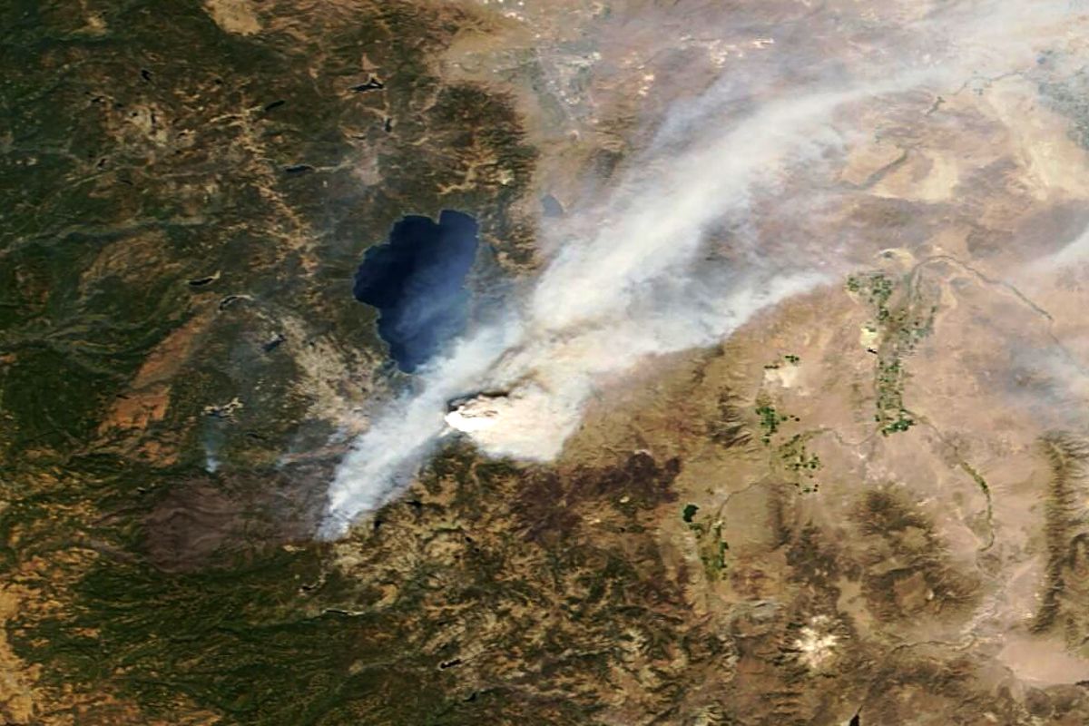 This Tuesday, Aug. 31, 2021, satellite image provided by Maxar Technologies shows an overview of smoke coming from the Caldor Fire near South Lake Tahoe, Calif. Favorable weather helped firefighters trying to save communities on the south end of Lake Tahoe from an approaching wildfire, but officials warned Wednesday that stiff winds and dry conditions mean that homes in the California-Nevada alpine region are still in danger.  (HONS)