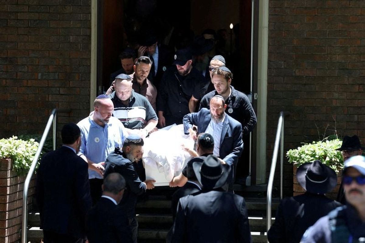 Mourners carry the casket of 10-year-old Matilda the youngest victim of a mass shooting at Australia