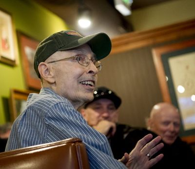 Tom Wobker (aka the Bard of Sherman Avenue), center smiles after being being revealed during Blogfest 2016 on Saturday, Feb. 20, 2016, at in Coeur d'Alene Wash. (Tyler Tjomsland/SR)