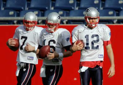 
No matter how the game goes, Patriots quarterback Tom Brady, right, is likely to play the entire night against the Jaguars, leaving backups Matt Cassel, center, and Matt Gutierrez on the bench. Associated Press
 (Associated Press / The Spokesman-Review)