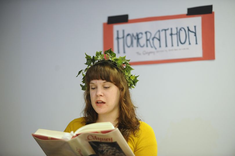 Gonzaga University student Bridget Carrick reads aloud from Homer's Odyssey Monday morning, Mar. 22, 2010 as the buzz of the conversation continues around her at the Crosby Student Center at GU as part of the 