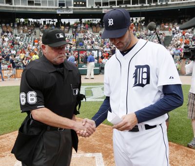 Umpire Jim Joyce, left, and pitcher Armando Galarraga can’t take field together while Galarraga is active player. (Associated Press)