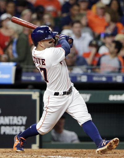Houston Astros second baseman Jose Altuve  watches his second home run during the fifth inning of a baseball game against the New York Yankees on Wednesday , April 10, 2019, in Houston. (Michael Wyke / Associated Press)