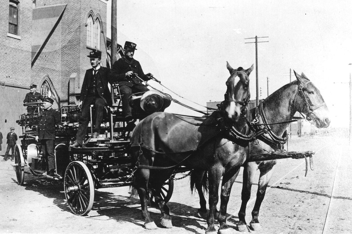 This photo was taken in 1894 in front of the Catholic church located on Main street at the east end of Washington. The Spokane Fire Department’s first extension ladder was this 75-foot Preston drawn by horses Prince and Charley, and manned by Frank Aiken, driver; George Squires sitting; Asa Hunter standing on the side and the tillerman Dan Collins at the rear. (Photo archives)