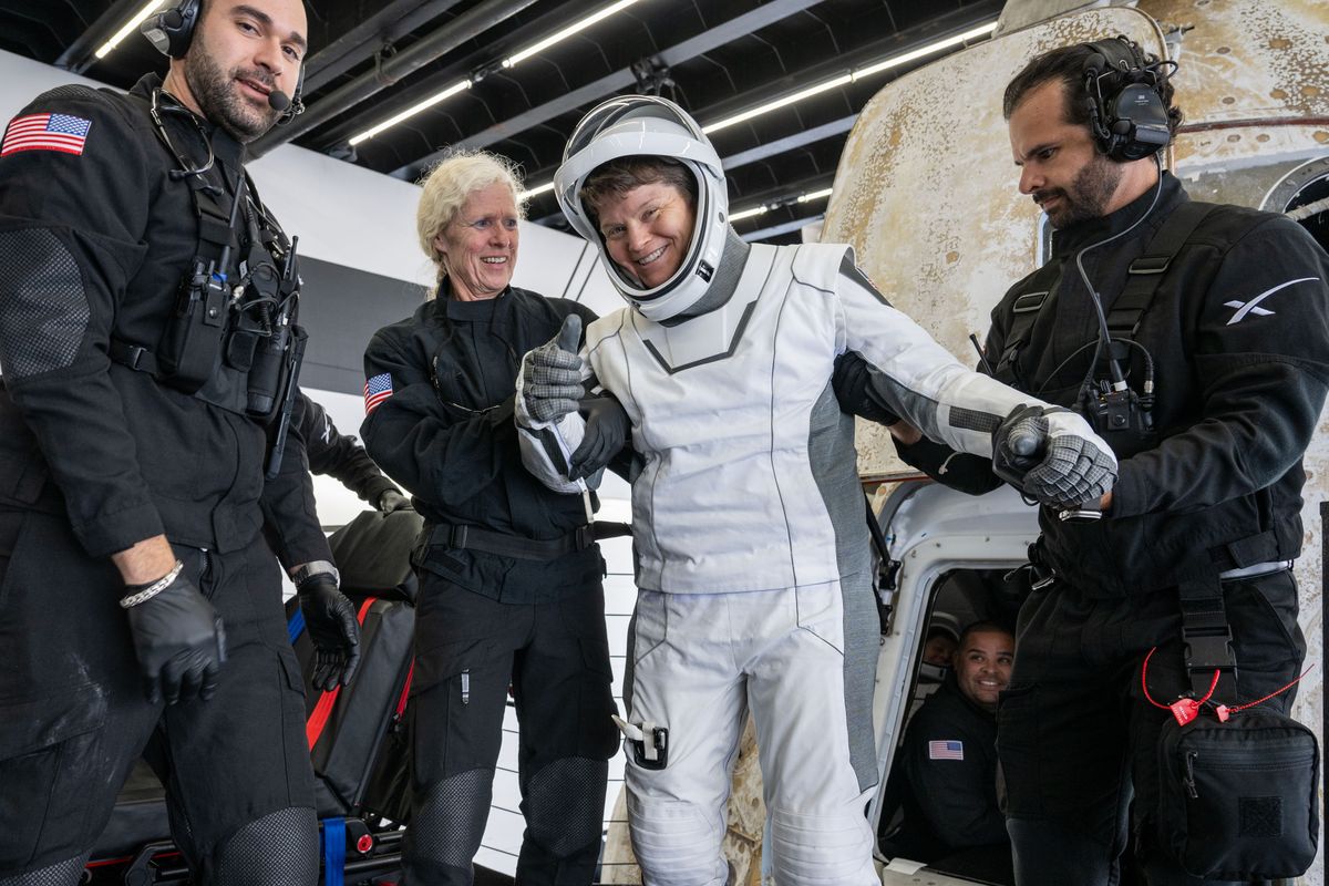 NASA astronaut Anne McClain is helped out of the SpaceX Dragon Endurance spacecraft onboard the SpaceX recovery ship Shannon after she and her crew landed in the Pacific Ocean Saturday off the coast of San Diego, Calif.  (Keegan Barber/NASA)